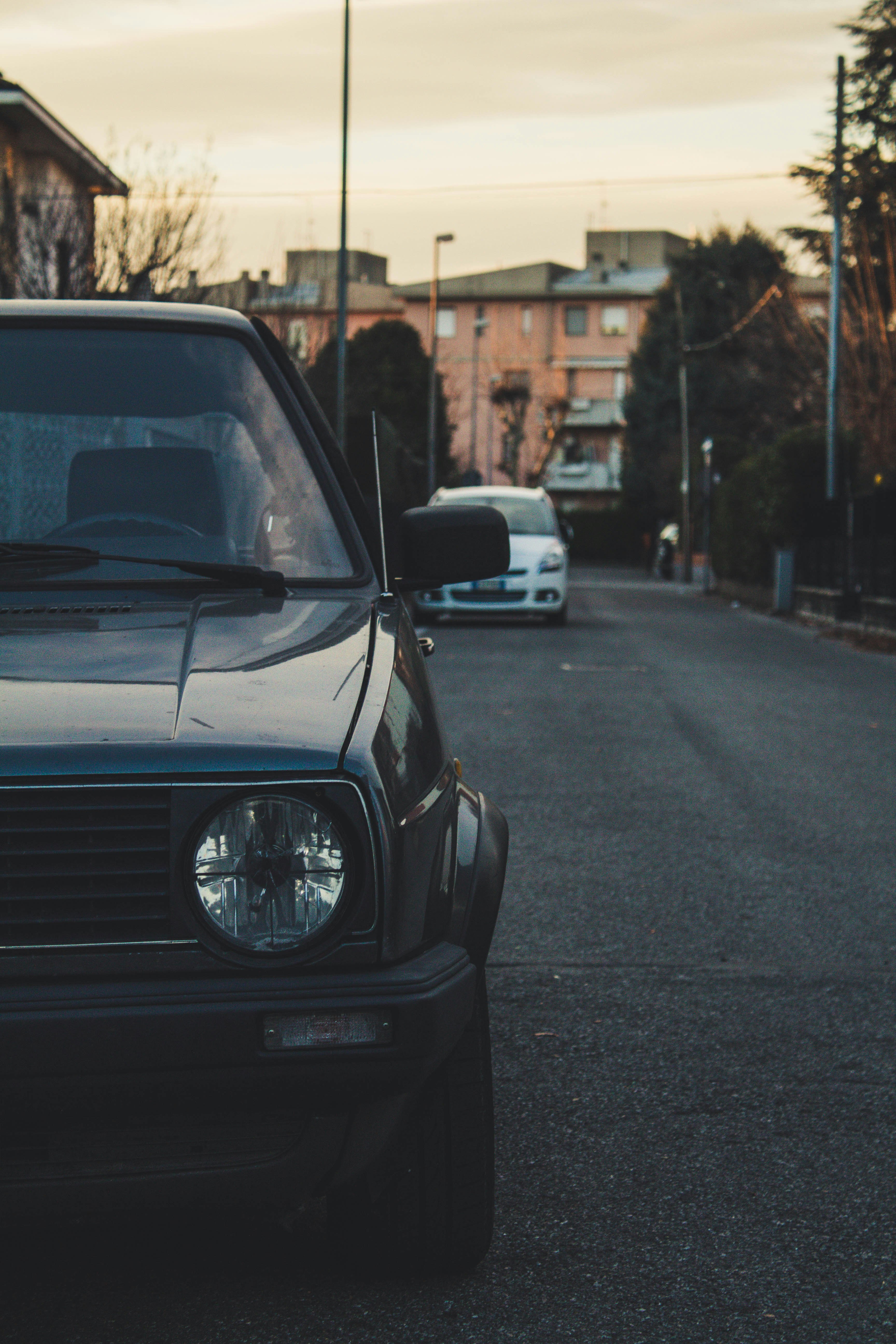 blue car parked near lamppost